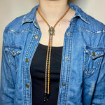 Load image into Gallery viewer, SOLD - Fly Bolo Tie – Orange &amp; Black Cord
