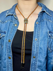 Load image into Gallery viewer, SOLD - Fly Bolo Tie – Orange &amp; Black Cord
