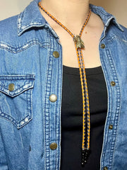 Load image into Gallery viewer, SOLD - Fly Bolo Tie – Orange &amp; Black Cord
