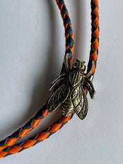 Load image into Gallery viewer, SOLD - Fly Bolo Tie – Orange &amp; Black Cord
